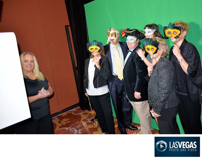 corporate event photo booth masked guests posing