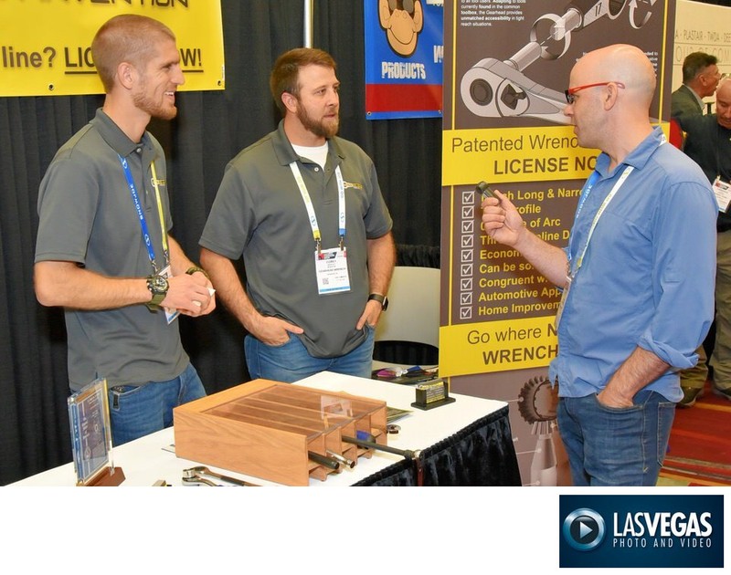 trade show photographer shows networking at the booth