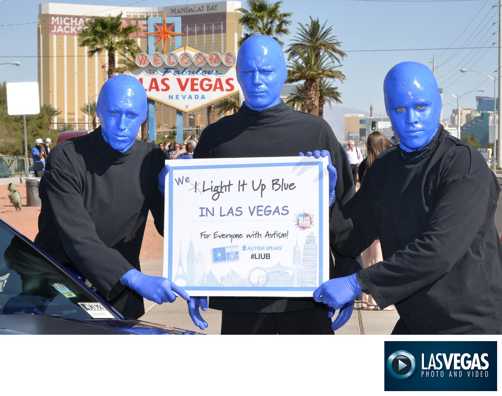 PR photography of the Blue Man Group at the Vegas sign