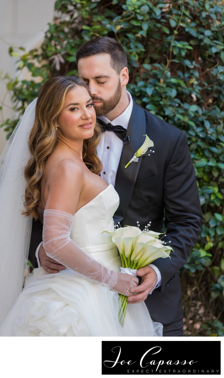 Groom kisses bride on wedding day in Florida 