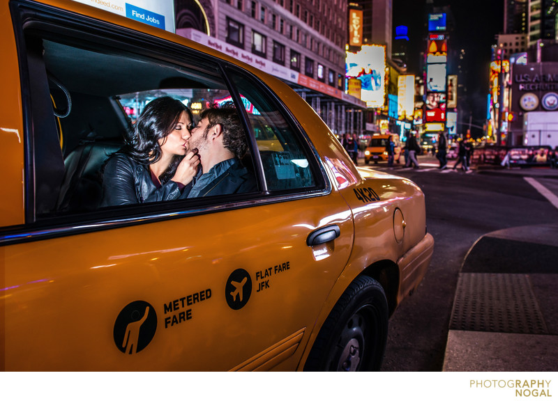 Couple Kissing in NYC Taxi Cab in Times Square