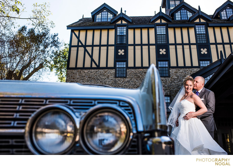 Bride and Groom Next To Classic Car at Old Mill Toronto