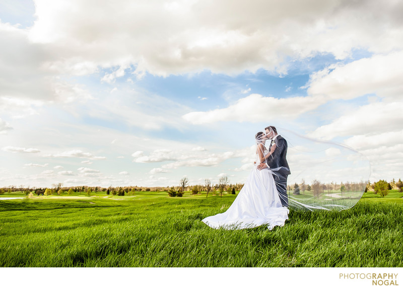 Bride and Groom Kiss at RattleSnake Point Golf Club