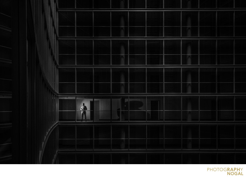 Groom Getting Ready in Large Empty Building