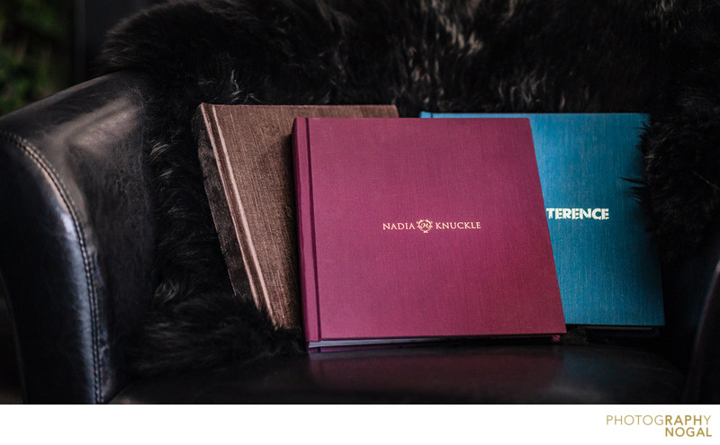 Wedding Albums on Display on a leather chair