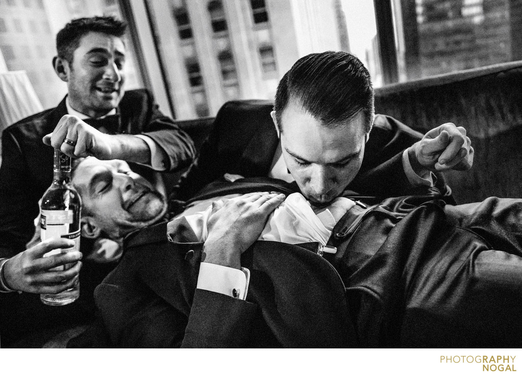 Groom and groomsmen doing a belly shot