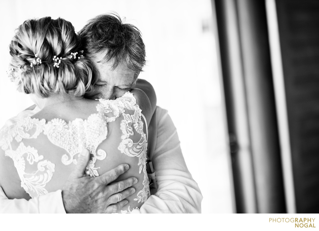 Bride and Father Embrace After First Look