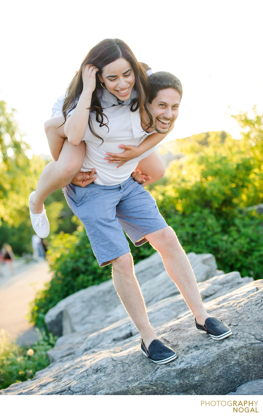 Port Credit session, man carries fiance over rocks
