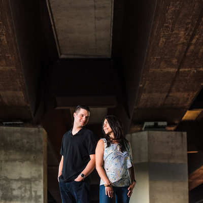 Toronto couple stands underneath Gardiner Expressway