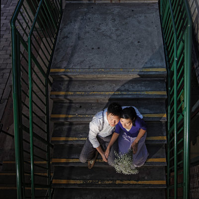 Young Toronto couple sits on the market staircase