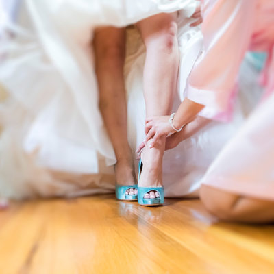 Bridesmaid Helping With Wedding Shoes