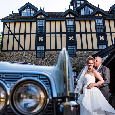 Bride and Groom Next To Classic Car at Old Mill Toronto