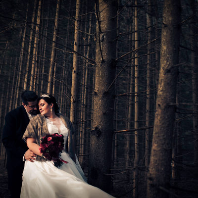 Bride and Groom in the Forest During Winter Wedding