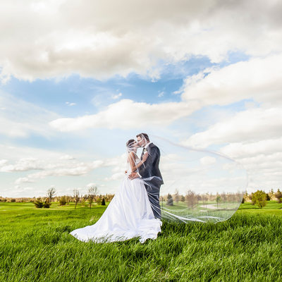 Bride and Groom Kiss at RattleSnake Point Golf Club