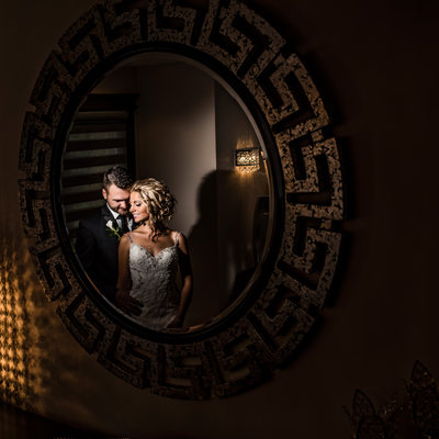 Couple Reflection in the Mirror on Wedding Day