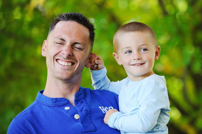 Kid pulling dads ear