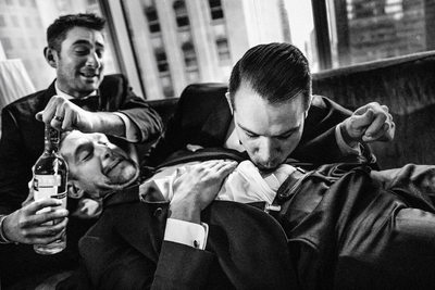 Groom and groomsmen doing a belly shot