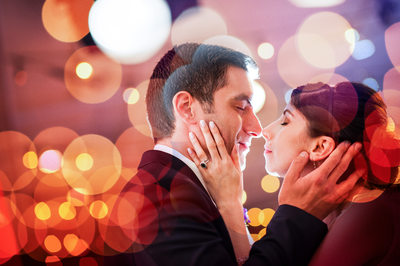 Bride and Groom About To Kiss in the Lights