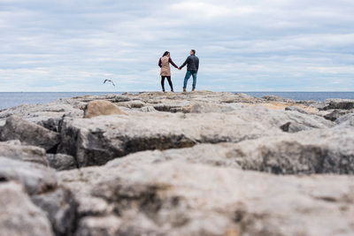 Couple holds hands, Sam Smith Park, Humber College