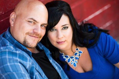 Toronto engagement couple in front of red wall