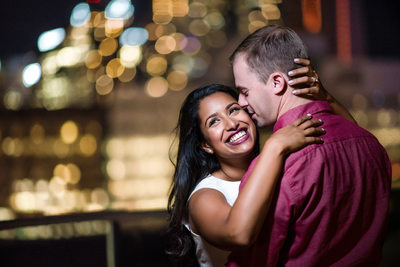 Laughing on a rooftop in Toronto condo