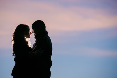 Couple Looking At Each Other during Sunset