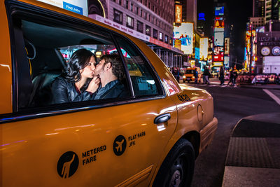 Couple Kissing in NYC Taxi Cab in Times Square