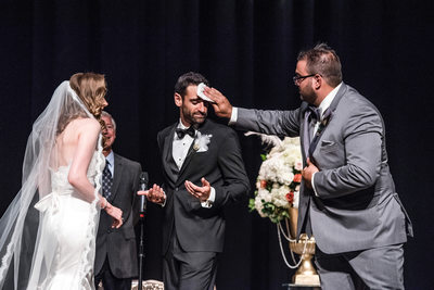 Wiping Sweat for Groom's Forehead