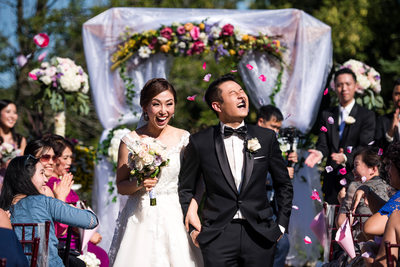 Groom Getting His In The Face With Flower Petals