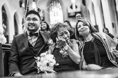 Bride's Mom Wiping Tears Away at Church