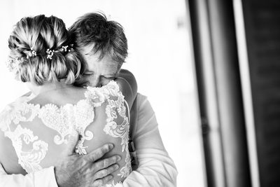 Bride and Father Embrace After First Look