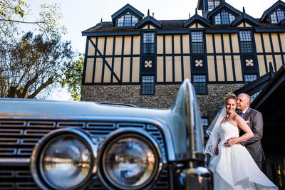 Bride and Groom Next To Classic Car at Old Mill Toronto