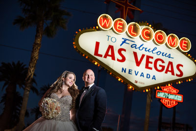 Bride and Groom in Front of Las Vegas Welcome Sign