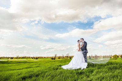 Bride and Groom Kiss at RattleSnake Point Golf Club