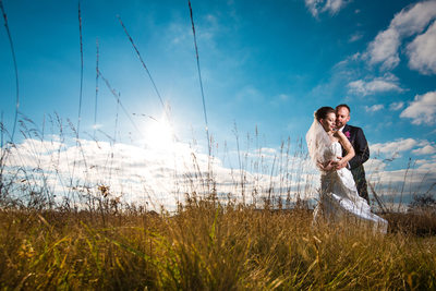 Hugging during Sunset at Sam Smith Park on Wedding Day