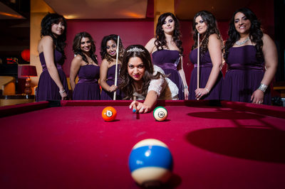 Bride and Bridesmaids Playing Pool 