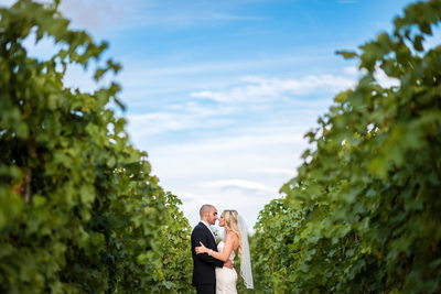 Couple in the Grape Vines at Hernder Estate Wines