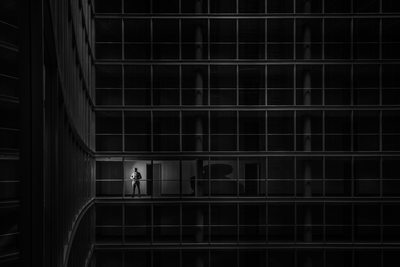 Groom Getting Ready in Large Empty Building