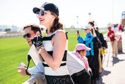 Couple enjoying horse racing in Etobicoke