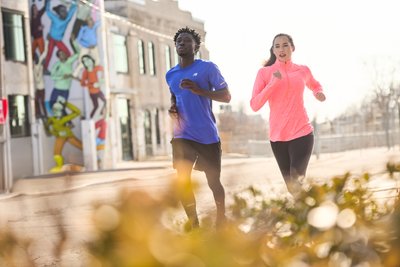 Couple enjoying a morning run in New Balance apparel