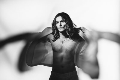 stylized portrait man putting on shirt