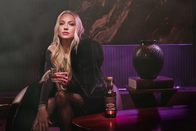 woman in bar having drink advertisement
