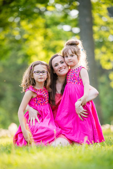 mom and two girls in pink dresses