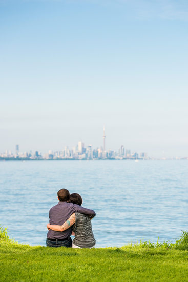 Toronto couple gazing upon downtown and CN tower