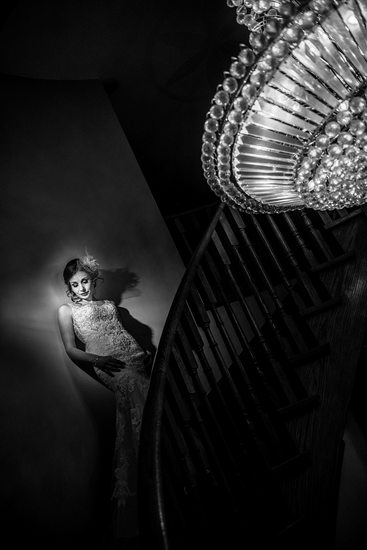 Bride on Stairs with Chandelier 