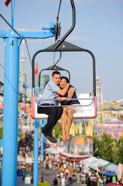 Engaged couple riding sky tram at CNE in Toronto