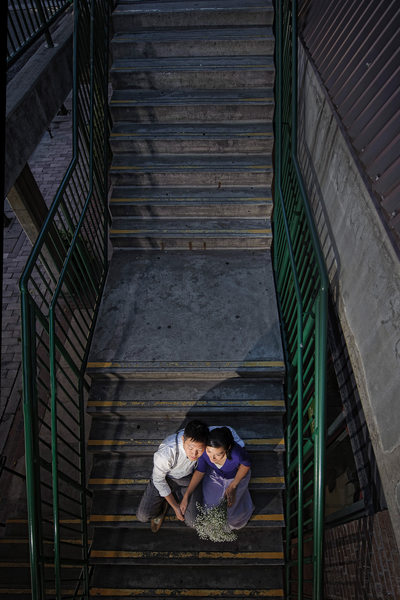 Young Toronto couple sits on the market staircase