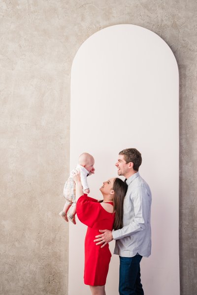 parents holding baby boy