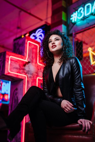 girl sitting on chair at neon museum