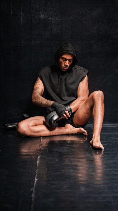 boxer putting on gloves